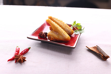 two fried wing chickens on red ceramic plate thumbnail