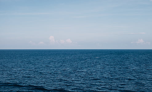 blue wavy ocean under blue sky during daytime thumbnail