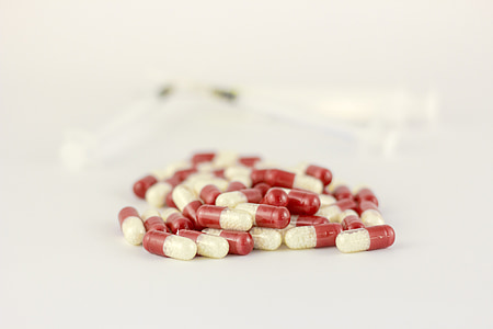 red-and-white medicine capsules thumbnail