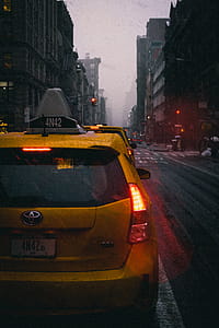 Close-Up Photography of Yellow Toyota Hatchback on Road thumbnail