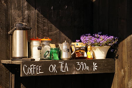 airpot on shelf beside jars and pot with flowers thumbnail