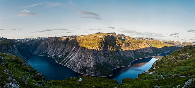 river surrounded by mountains at daytime thumbnail