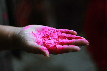 person's right hand holding pink powder thumbnail