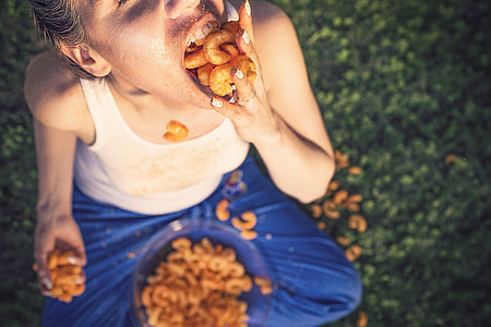 woman eating mouthful of chips thumbnail