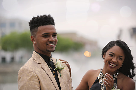 man standing beside woman thumbnail