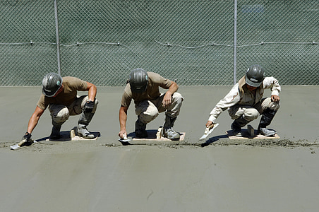three men using finishing trowels thumbnail
