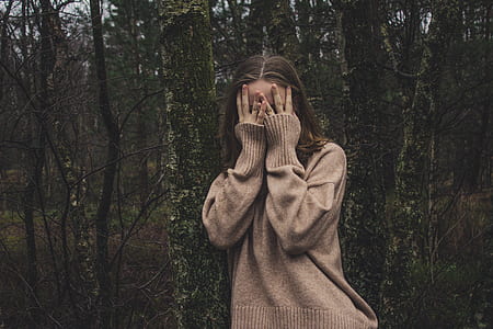 woman wearing brown sweater thumbnail