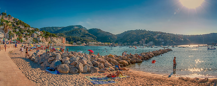 people playing on seashore during daytime photo thumbnail