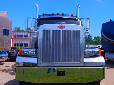 selective focus photography of black Peterbilt truck thumbnail