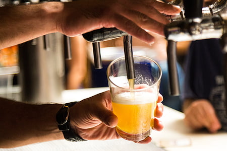 timelapse photography of man pressing the beverage dispenser thumbnail