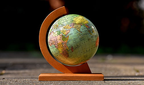 shallow focus photo of desk globe thumbnail