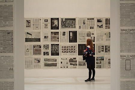 woman looking at wall arts thumbnail