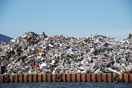 pile garbage near body of water thumbnail
