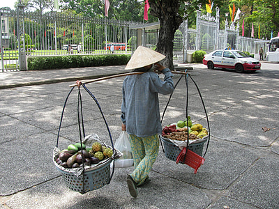 man carrying baskets of fruits thumbnail