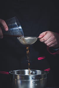 person holding cup and stainer thumbnail