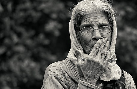 grayscale photography of woman wearing eyeglasses thumbnail