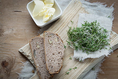 two toasted bread on brown chopping board thumbnail