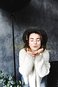 Female Wearing Hat Blowing Kisses thumbnail
