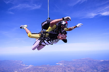 person paragliding during daytime thumbnail
