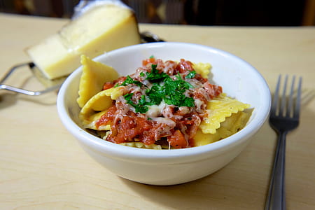 Yellow Baked Pasta on White Ceramic Bowl on Beige Surface thumbnail