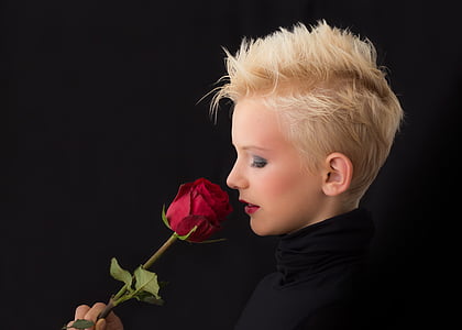 woman holding red rose thumbnail