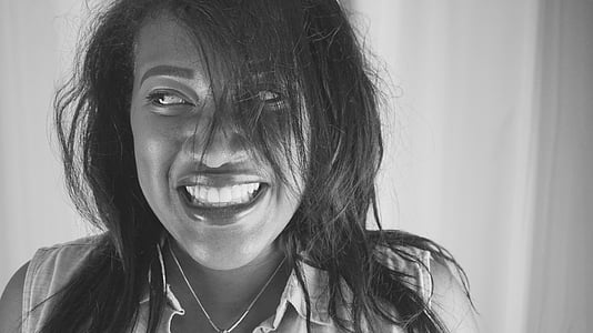 woman smiling in grayscale photography thumbnail
