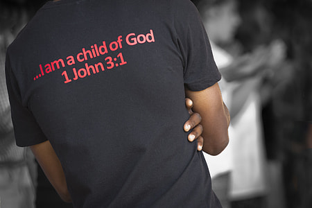 person wearing black I am a Child of God 1 John 3:1 printed T-shirt thumbnail