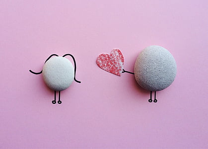 gray stone giving heart to another gray stone thumbnail