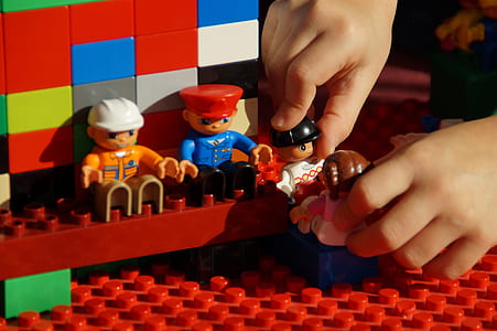 toddler playing plastic toys thumbnail