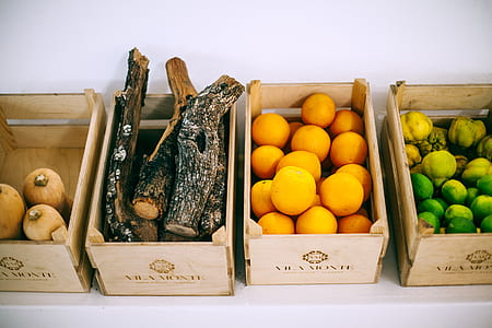 three variety of fruits on boxes and wood log on box thumbnail