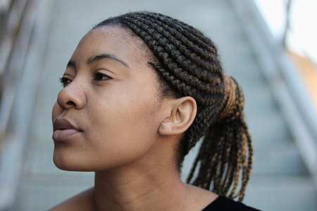Woman Wearing Black and and Brown Scrunchies Looking Sideways Near Stairs thumbnail