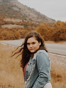 woman wearing blue denim jacket thumbnail
