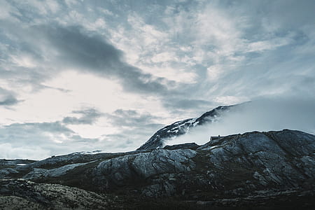 gray hills under clouds thumbnail