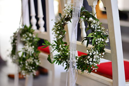 white baby's-breath wreath hung on chair thumbnail