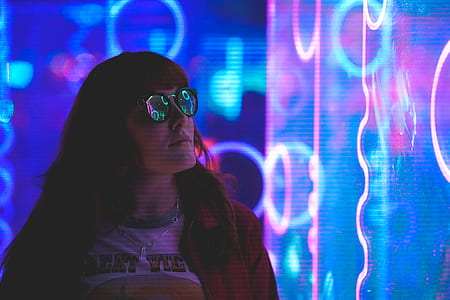 woman standing near neon lights thumbnail