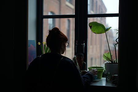 woman facing close window thumbnail