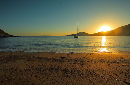 white boat in body of water during golden hour thumbnail