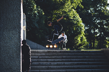 man skating on stairway during daytime thumbnail