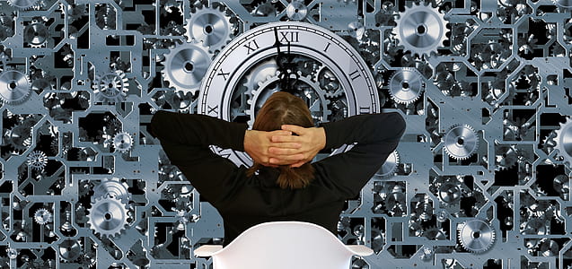 person sitting on armchair looking at mechanical clocks thumbnail