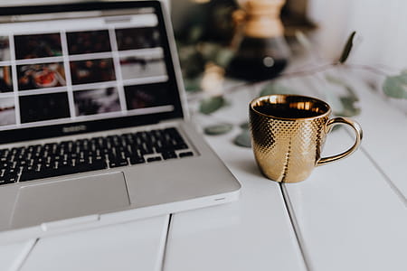 Apple MacBook & Coffee on the white desk thumbnail