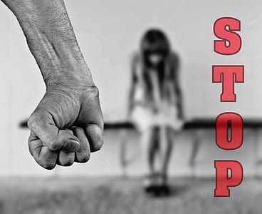 selective color photo of stop with fist violence thumbnail
