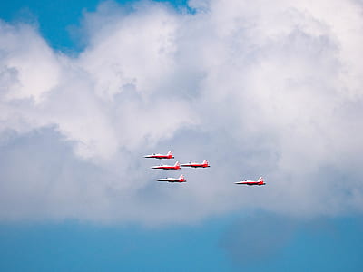 five aircraft under cloudy sky thumbnail