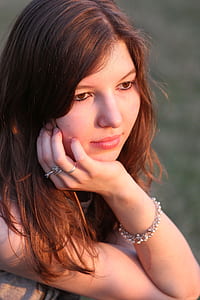 woman in silver-colored rings and bracelet thumbnail