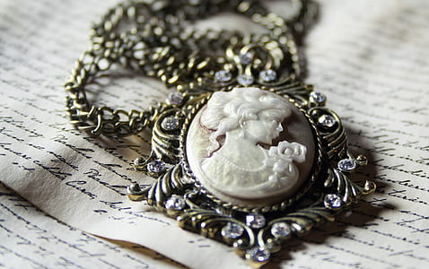 silver-colored cameo pendant thumbnail