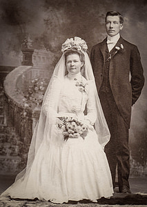 woman wearing wedding gown beside man wearing suit thumbnail