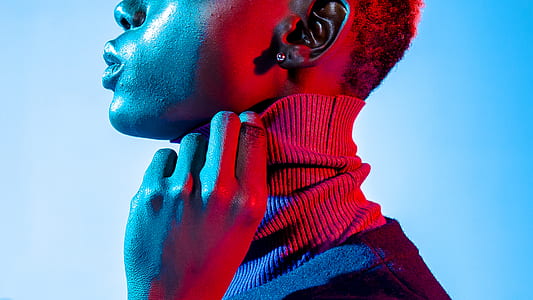 close-up photo of person wearing gray turtleneck top thumbnail