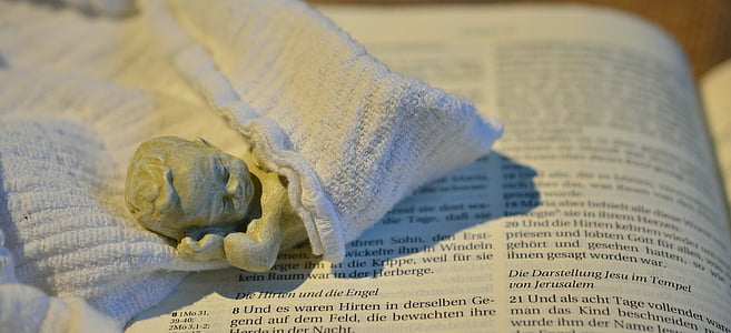angle ceramic figurine on book thumbnail