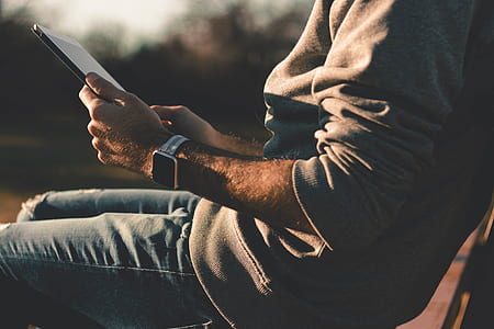 person holding tablet sitting on chair thumbnail