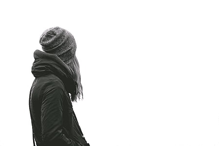 person wearing knit cap and hooded jacket thumbnail