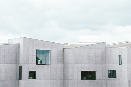 gray building standing beside each other thumbnail